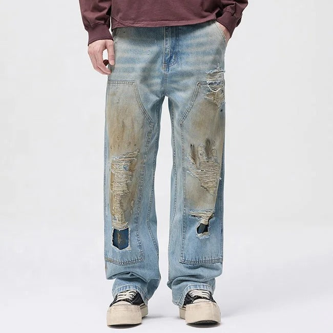 Light blue distressed jeans with faded wash and ripped details