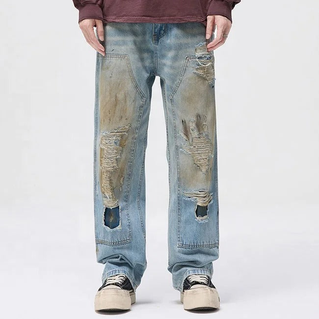 Light blue distressed jeans with faded wash and ripped details
