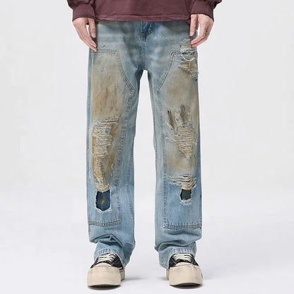 Light blue distressed jeans with faded wash and ripped details