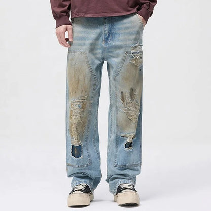 Light blue distressed jeans with faded wash and ripped details