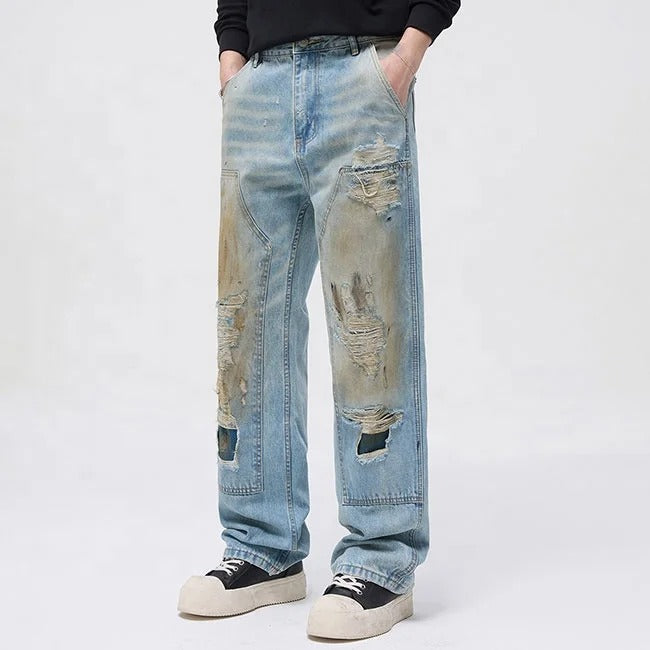 Light blue distressed jeans with faded wash and ripped details