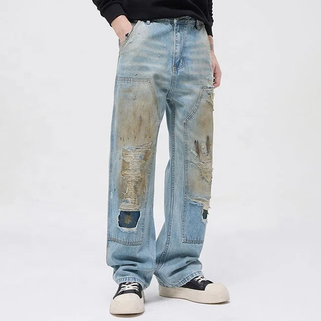 Light blue distressed jeans with faded wash and ripped details