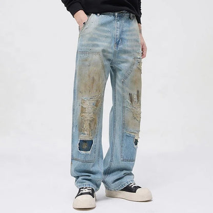 Light blue distressed jeans with faded wash and ripped details